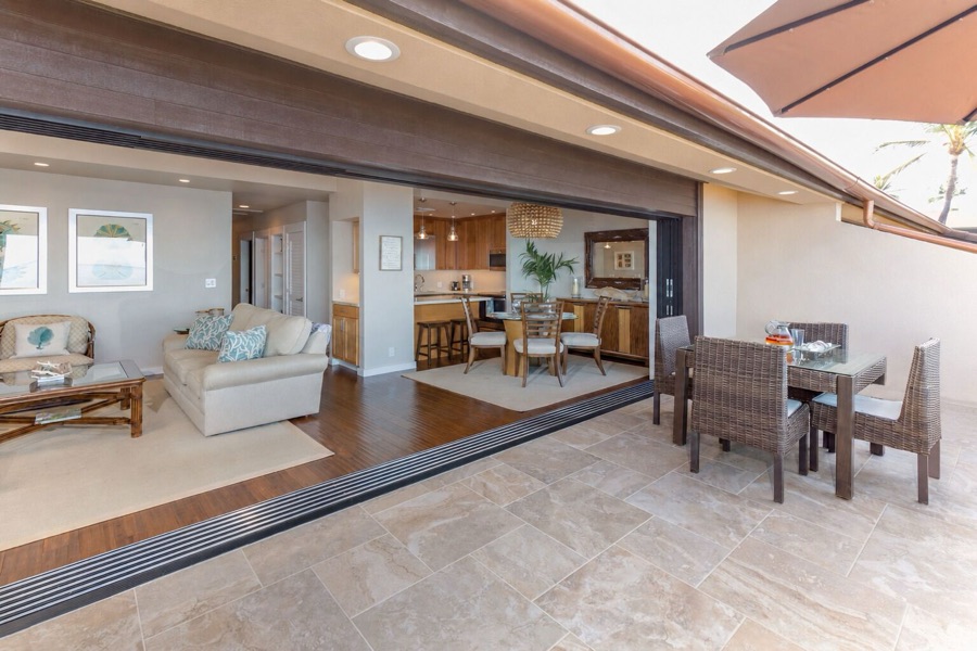 Living and dining rooms seen from the lanai, sliders open
